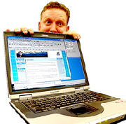 Jamie hiding behind a laptop